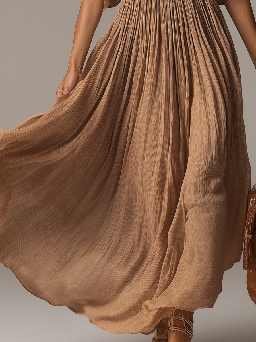 Robe longue fluide à col en V et perles élégante