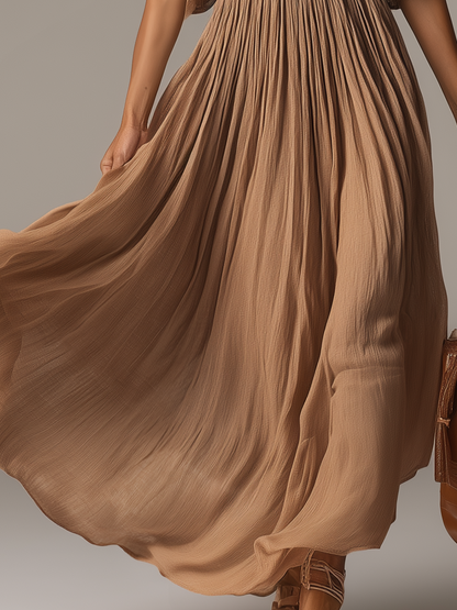 Robe longue fluide à col en V et perles élégante