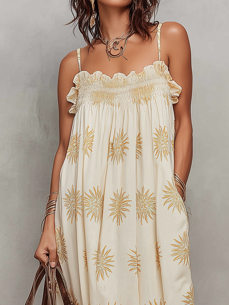 Robe longue smockée à fines bretelles imprimé soleil Sunny