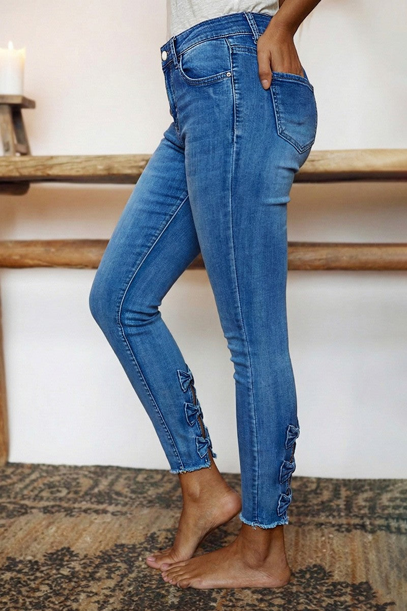 Raw Hem Cut Out Bow Tie Mid Waist Crop Skinny Jeans