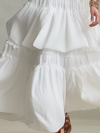 Robe longue bohème vaporeuse à col montant et volants