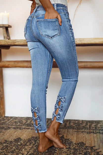 Raw Hem Cut Out Bow Tie Mid Waist Crop Skinny Jeans