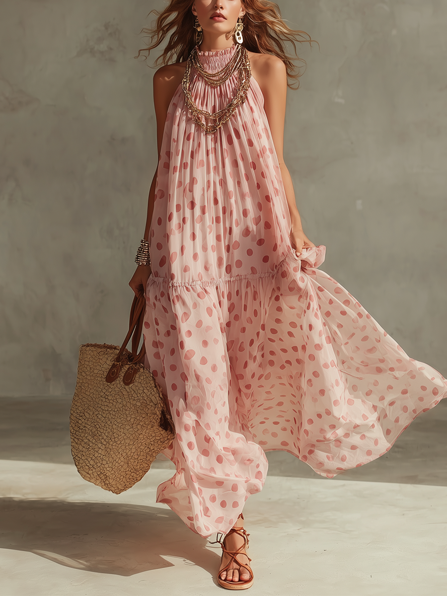 Robe longue à pois roses style complexe hôtelier, dos nu et fluide