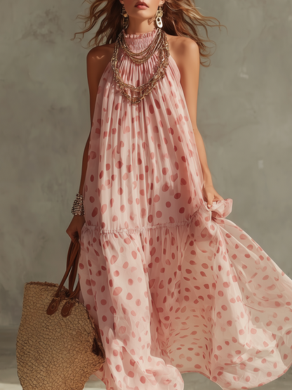 Robe longue à pois roses style complexe hôtelier, dos nu et fluide