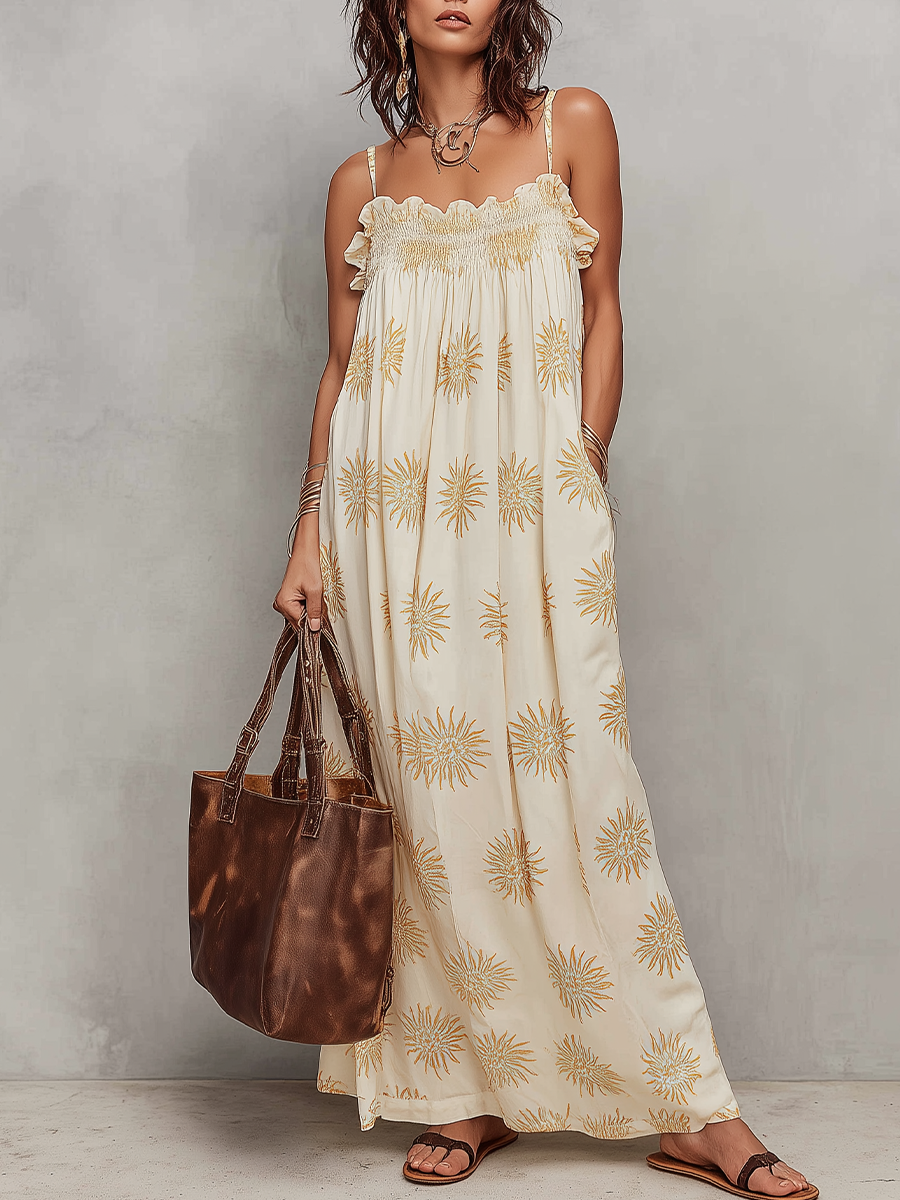 Robe longue smockée à fines bretelles imprimé soleil Sunny