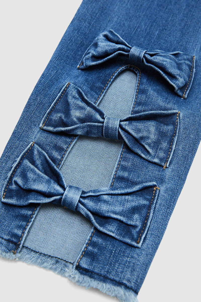 Raw Hem Cut Out Bow Tie Mid Waist Crop Skinny Jeans