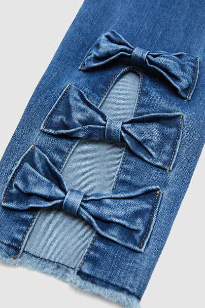 Raw Hem Cut Out Bow Tie Mid Waist Crop Skinny Jeans