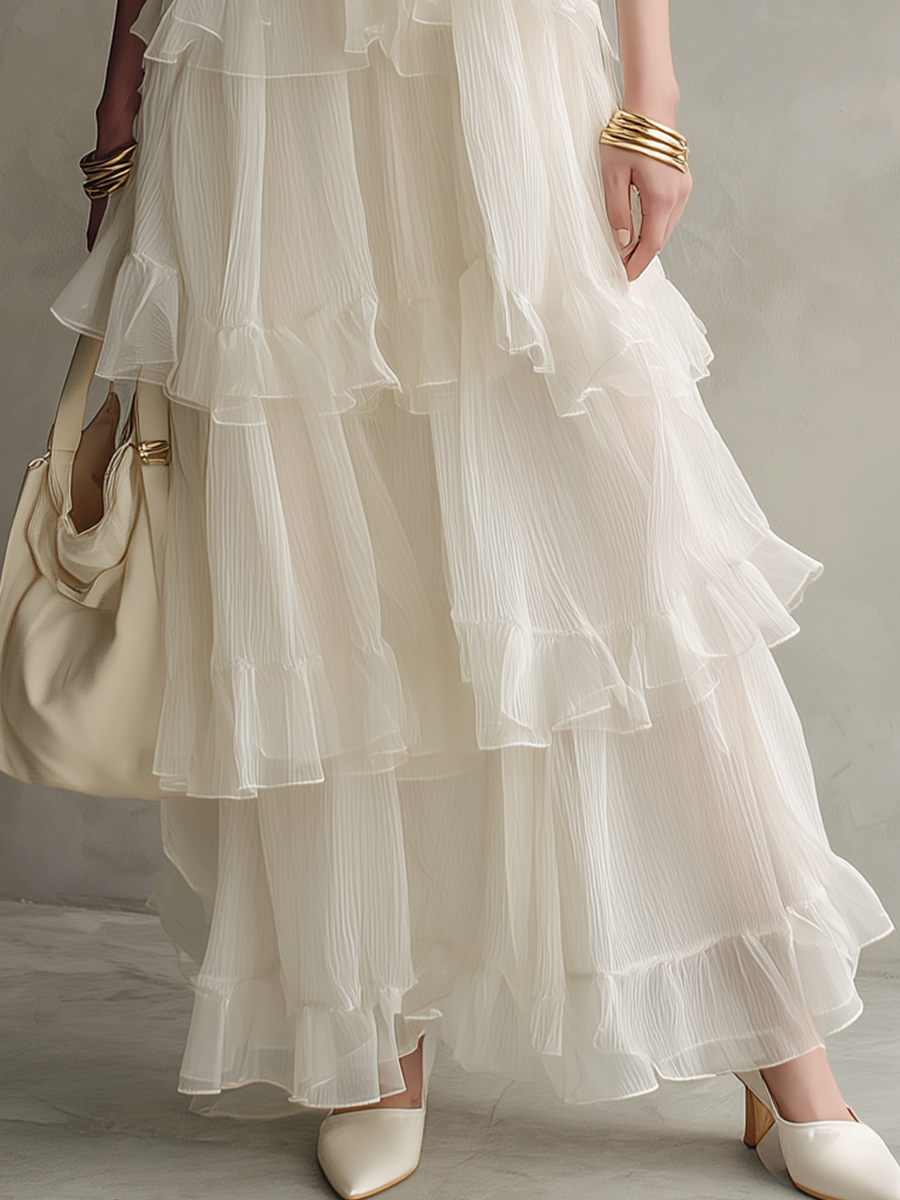 Robe longue étagée en ivoire éthéré